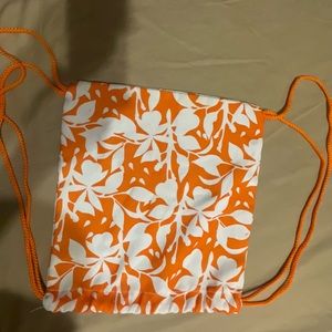 Orange and white bag with flowers